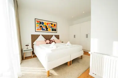 Ein Bett oder Betten in einem Zimmer der Unterkunft Elegant Residence Near Old Town & Mosel River