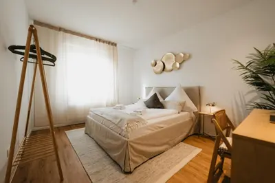 Ein Bett oder Betten in einem Zimmer der Unterkunft Elegant Residence Near Old Town & Mosel River