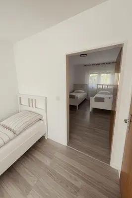 Ein Bett oder Betten in einem Zimmer der Unterkunft Family & Friends Residence