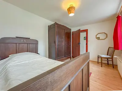 Ein Bett oder Betten in einem Zimmer der Unterkunft Der Lebendige Garten