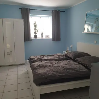 Ein Bett oder Betten in einem Zimmer der Unterkunft Ferienwohnung Stefanie am Frankenbach