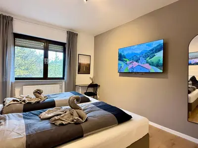 Ein Bett oder Betten in einem Zimmer der Unterkunft KO 3-Zimmer Apartment 73 qm bis zu 6 Personen
