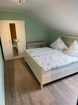 Ein Bett oder Betten in einem Zimmer der Unterkunft Eifelnest Stadtkyll