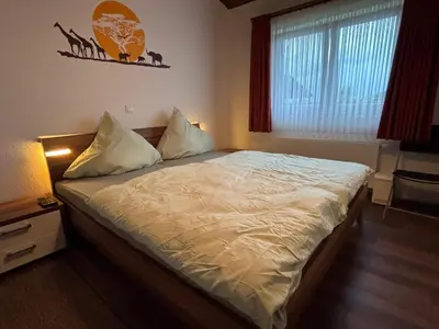 Ein Bett oder Betten in einem Zimmer der Unterkunft Haus am See