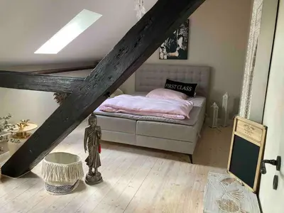 Ein Bett oder Betten in einem Zimmer der Unterkunft Historisches Designer Loft Namaste