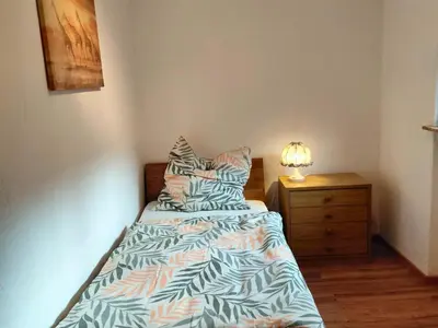 Ein Bett oder Betten in einem Zimmer der Unterkunft Holiday Home in Birresborn with balcony
