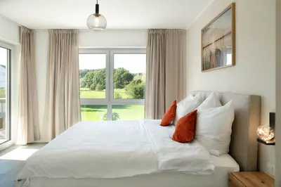 Ein Bett oder Betten in einem Zimmer der Unterkunft Premiumzeit Apartments Bostalsee - Whirlpool, Sauna
