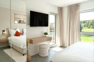 Ein Bett oder Betten in einem Zimmer der Unterkunft Premiumzeit Apartments Bostalsee - Whirlpool, Sauna