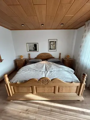 Ein Bett oder Betten in einem Zimmer der Unterkunft Ferienwohnung Hocheifelblick