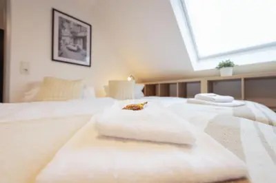 Ein Bett oder Betten in einem Zimmer der Unterkunft VonMos Burg&Moselblick
