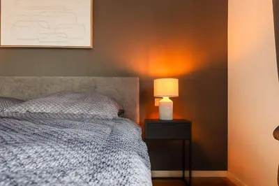 Ein Bett oder Betten in einem Zimmer der Unterkunft Vulkan-Suite