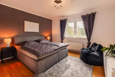 Ein Bett oder Betten in einem Zimmer der Unterkunft Vulkan-Suite