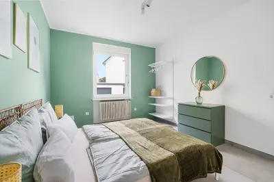 Ein Bett oder Betten in einem Zimmer der Unterkunft Moderne Traumwohnung mit Traumgarten