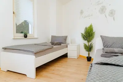 Ein Bett oder Betten in einem Zimmer der Unterkunft Lahnstein Gruppenquartier 170 qm