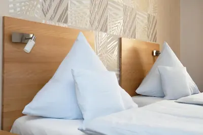 Ein Bett oder Betten in einem Zimmer der Unterkunft Rieslinghaus Bernkastel (ehm.Weinhaus Porn)