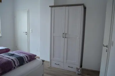 Ein Bett oder Betten in einem Zimmer der Unterkunft Ferienwohnungen Felten in Minheim