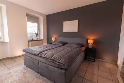 Ein Bett oder Betten in einem Zimmer der Unterkunft Basalt-Suite