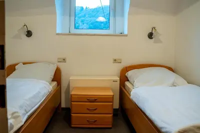 Ein Bett oder Betten in einem Zimmer der Unterkunft Mosella FeWo