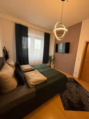 Ein Bett oder Betten in einem Zimmer der Unterkunft Koblenz City - 3-Zimmer Apartment an der Balduinbrücke