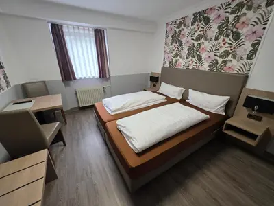 Ein Bett oder Betten in einem Zimmer der Unterkunft Hotel Montag