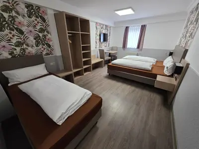 Ein Bett oder Betten in einem Zimmer der Unterkunft Hotel Montag