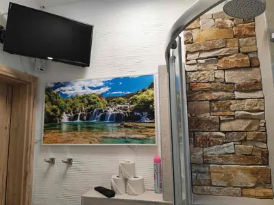 Ein Badezimmer in der Unterkunft Holiday Home City FH Vulkaneinfel by Interhome