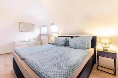 Ein Bett oder Betten in einem Zimmer der Unterkunft Eifel-Lodge Ferienhaus