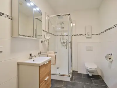 Ein Badezimmer in der Unterkunft Marx - Modernes Apartment - Top Lage im Zentrum - Gratis WLAN - ideal für Geschäftsreisende & Paare