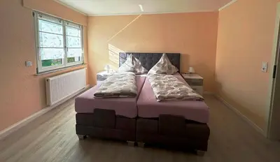 Ein Bett oder Betten in einem Zimmer der Unterkunft Ferienwohnung Lena