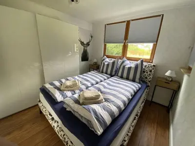 Ein Bett oder Betten in einem Zimmer der Unterkunft Eifelcottage Wren