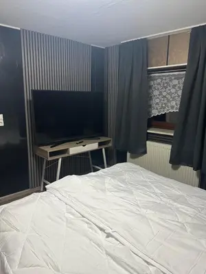 Ein Bett oder Betten in einem Zimmer der Unterkunft Freilinger See Bar