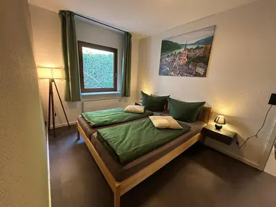 Ein Bett oder Betten in einem Zimmer der Unterkunft Ferienwohnung RebenGlück