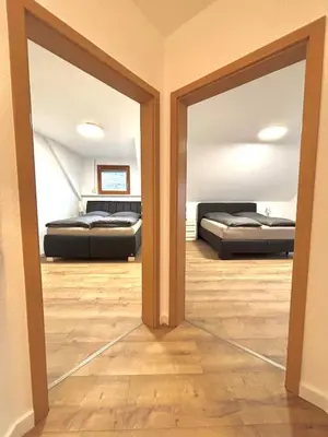 Ein Bett oder Betten in einem Zimmer der Unterkunft Ferienhaus an der Burg Coraidelstein