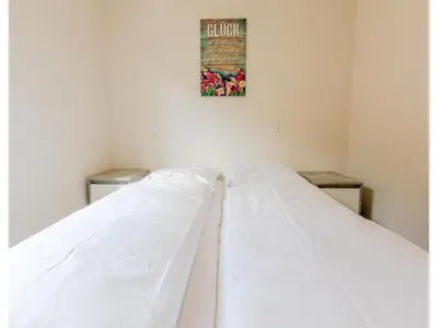 Ein Bett oder Betten in einem Zimmer der Unterkunft Bungalow im Campingpark