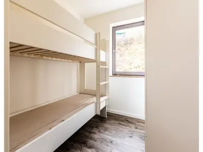 Ein Bett oder Betten in einem Zimmer der Unterkunft Bungalow im Campingpark
