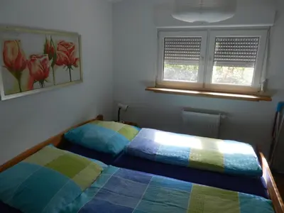 Ein Bett oder Betten in einem Zimmer der Unterkunft Eifelcottage Stork's Nest