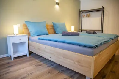Ein Bett oder Betten in einem Zimmer der Unterkunft Ferienhaus zum Brauneberg