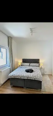 Ein Bett oder Betten in einem Zimmer der Unterkunft Modernes Apartment mit gehobener Ausstattung