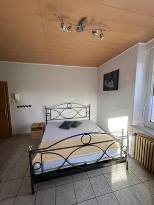 Ein Bett oder Betten in einem Zimmer der Unterkunft Apartment Basile