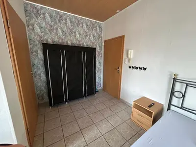 Ein Bett oder Betten in einem Zimmer der Unterkunft Apartment Basile