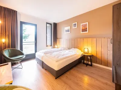 Ein Bett oder Betten in einem Zimmer der Unterkunft Couple stay at Hambachtal Holiday Park