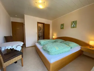 Ein Bett oder Betten in einem Zimmer der Unterkunft Gästehaus im Oberdorf