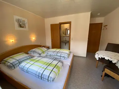 Ein Bett oder Betten in einem Zimmer der Unterkunft Gästehaus im Oberdorf