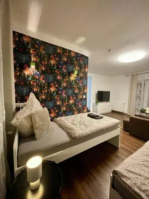 Ein Bett oder Betten in einem Zimmer der Unterkunft Gemütliches EG-Apartment in Weißenthurm für 6