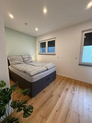 Ein Bett oder Betten in einem Zimmer der Unterkunft Moselzeit - Ferienwohnung 