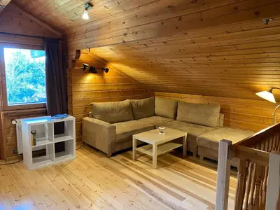 Ein Sitzbereich in der Unterkunft Holiday Home Chalet mit Garten- Grill und Terrasse by Interhome