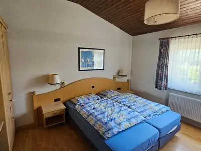 Ein Bett oder Betten in einem Zimmer der Unterkunft Holiday Home mit Garten im Naturpark Südeifel by Interhome