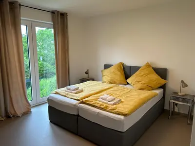 Ein Bett oder Betten in einem Zimmer der Unterkunft Ferienwohnung in Bendorf am Rhein