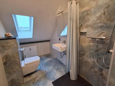 Ein Badezimmer in der Unterkunft FeWo Bodo