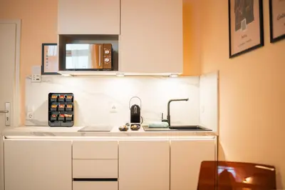 Küche/Küchenzeile in der Unterkunft LLR Design Apartment am Bahnhof - Palermo Peach